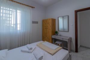 Postel nebo postele na pokoji v ubytování Beachside Apartment-1