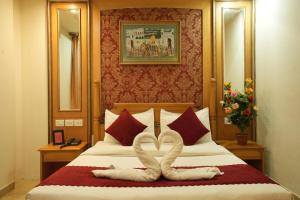 Postel nebo postele na pokoji v ubytování Hotel Maru Casa