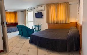 Postel nebo postele na pokoji v ubytování Hotel Excelsior