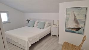 Posteľ alebo postele v izbe v ubytovaní Bella Apartments