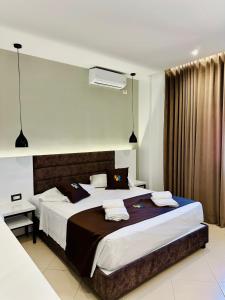 Postel nebo postele na pokoji v ubytování Relax Apts Saranda