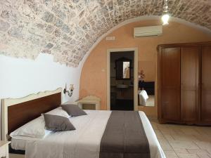 Postel nebo postele na pokoji v ubytování B&B Il Mulino del Monastero