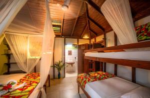 Postel nebo postele na pokoji v ubytování Hibiscus Valley Inn