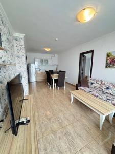 A kitchen or kitchenette at OLYMP Apart-Complex