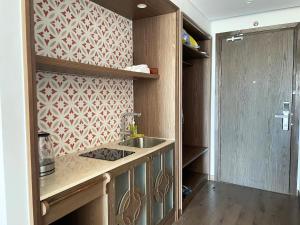 Kuchyň nebo kuchyňský kout v ubytování Cactos Inn Apartment APEC Mandala Cham Bay Mui Ne