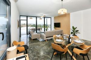 a living room with a table and chairs at Villa Guadiana Golf 2 in Ayamonte