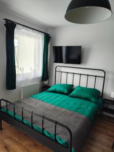 Ένα ή περισσότερα κρεβάτια σε δωμάτιο στο Apartament Nero Verde