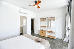 a bedroom with a bed and a ceiling fan at Villa Guadiana Golf 2 in Ayamonte +36 photos
