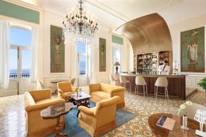 a living room with a bar in a building at Imperial Hotel Tramontano in Sorrento