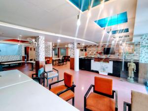 a dining room with a table and chairs at Hotel Apex Intercontinental in Jaipur