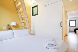Ein Bett oder Betten in einem Zimmer der Unterkunft Ola Living Vidreria