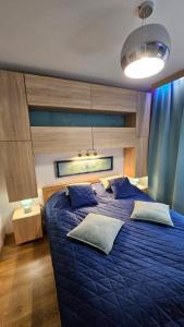 Ένα ή περισσότερα κρεβάτια σε δωμάτιο στο Apartament Szafir Polanica Zdrój centrum