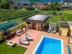 an aerial view of a house with a swimming pool at BRICK Studio in Bajina Bašta