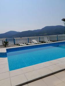 a swimming pool in front of a building at Casa Yuppy Du in Eşelniţa