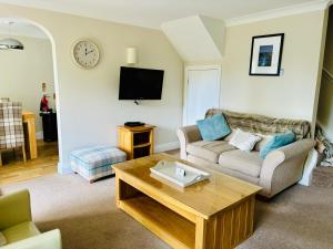 a living room with a couch and a coffee table at The Boatside Inn in Hexham