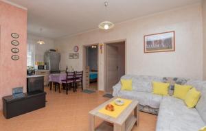 a living room with a couch and a table at Villa Vega - Makarska by Villas Guide 