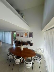 a dining room with a wooden table and chairs at Villa Marta in Alicante