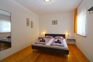 Postel nebo postele na pokoji v ubytování Apartment Bozana 1840