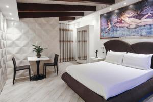Posteľ alebo postele v izbe v ubytovaní Albergo Pompei Valley