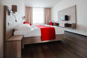 Postel nebo postele na pokoji v ubytování Hotel Palác Elektra