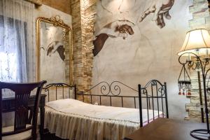 a bedroom with a bed and a mirror at Sani Villa Elmira in Sani Beach