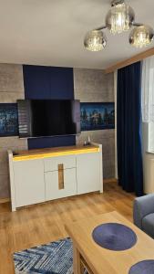 Μια τηλεόραση ή/και κέντρο ψυχαγωγίας στο Apartament Szafir Polanica Zdrój centrum