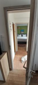 Posteľ alebo postele v izbe v ubytovaní Apartman sunny green
