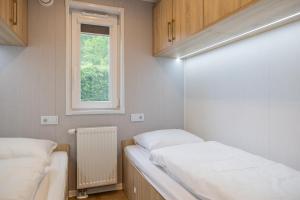 Postel nebo postele na pokoji v ubytování Chalet Unique