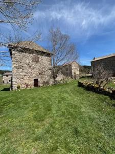an old stone building in a field of grass at Maison avec balcon à Borne, 70 m², 5 personnes avec jardin in Mayres +21 photos