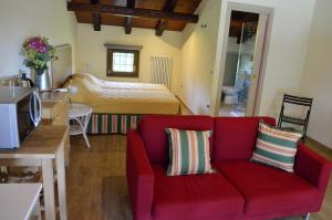 Ένα ή περισσότερα κρεβάτια σε δωμάτιο στο agriturismo Cà Roer