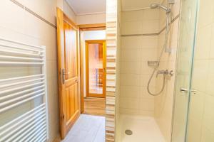 a bathroom with a shower and a walk in shower at Rooms&Apartments Pazlar in Bled +67 photos