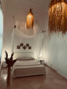 Llit o llits en una habitació de Borgo Rosalia 17 fotos més