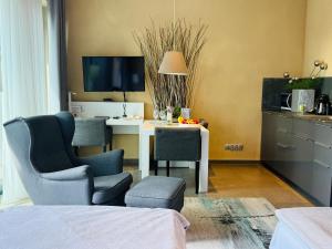 Televízia a/alebo spoločenská miestnosť v ubytovaní Jasna SportHotel & SPA