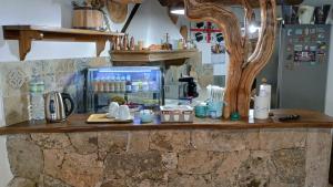 a stone counter with a coffee maker on it at ANTICHE TERRE Di GALLURA in Monti +24 photos
