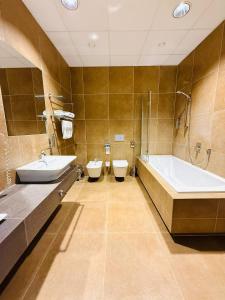 Kúpeľňa v ubytovaní Jasna SportHotel & SPA