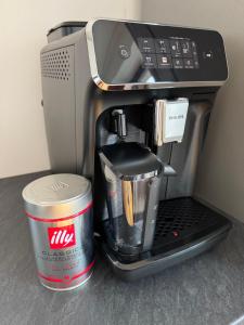 a coffeemaker with a coffee maker with a cup at Rezidence Kotnov Tábor in Tábor