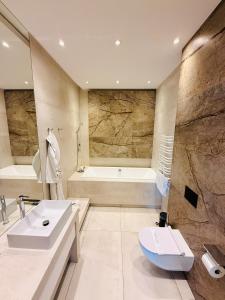 Kúpeľňa v ubytovaní Jasna SportHotel & SPA