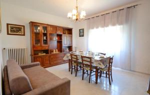 a kitchen and dining room with a table and chairs at Cozy Home In Suvereto With Wifi in Suvereto