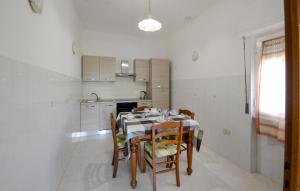 a dining room with a table and chairs in a kitchen at Cozy Home In Suvereto With Wifi in Suvereto