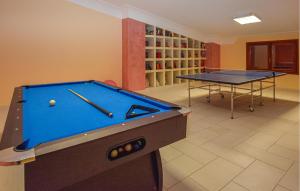 a billiard room with a pool table and two tables at Gorgeous Home In Vittoria in Vittoria