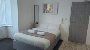 Ένα ή περισσότερα κρεβάτια σε δωμάτιο στο Sunderland Executive Stay