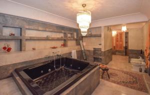 a large bath tub in a large room at Gorgeous Home In Vittoria in Vittoria