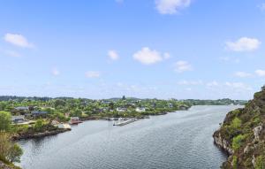 a view of a river with houses and a town at Nice Home In Manger With House Sea View in Manger +15 photos