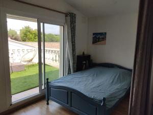 En eller flere senge i et værelse på Maison en centre ville au calme