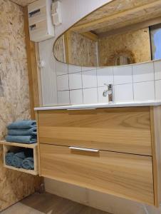 a bathroom with a sink and a mirror at Studio Chapelle in Dunkerque