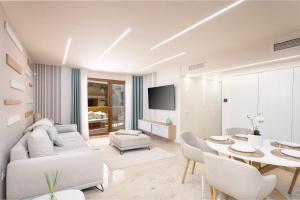 a living room with a couch and a table at CC8 III by ZANIS in Torrevieja