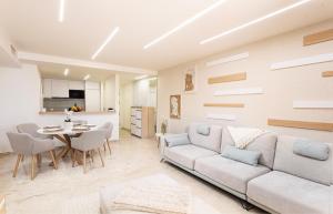 a living room with a couch and a table at CC8 III by ZANIS in Torrevieja