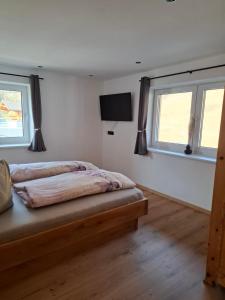 Postel nebo postele na pokoji v ubytování Appartement Reichholf