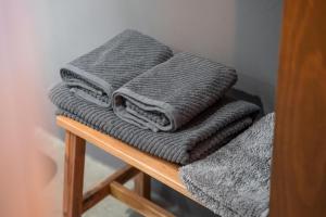 a pile of towels sitting on a wooden shelf at Casa Rural El Ahora in Berge +13 photos