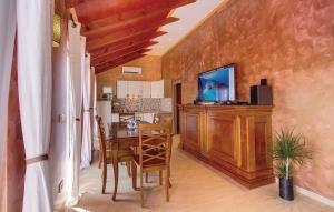 a kitchen and dining room with a table and chairs at House Victoria 1 by Villas Guide in Nerezine
